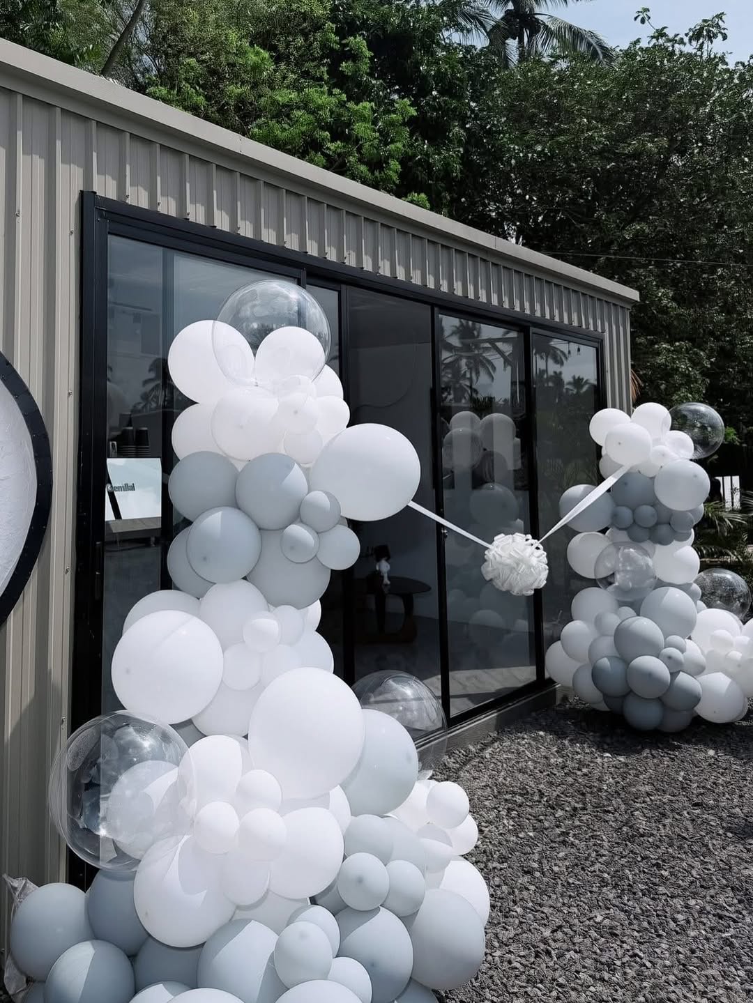 Moon Coffee 2.0 exterior decorated with white and grey balloon garlands for the grand opening event