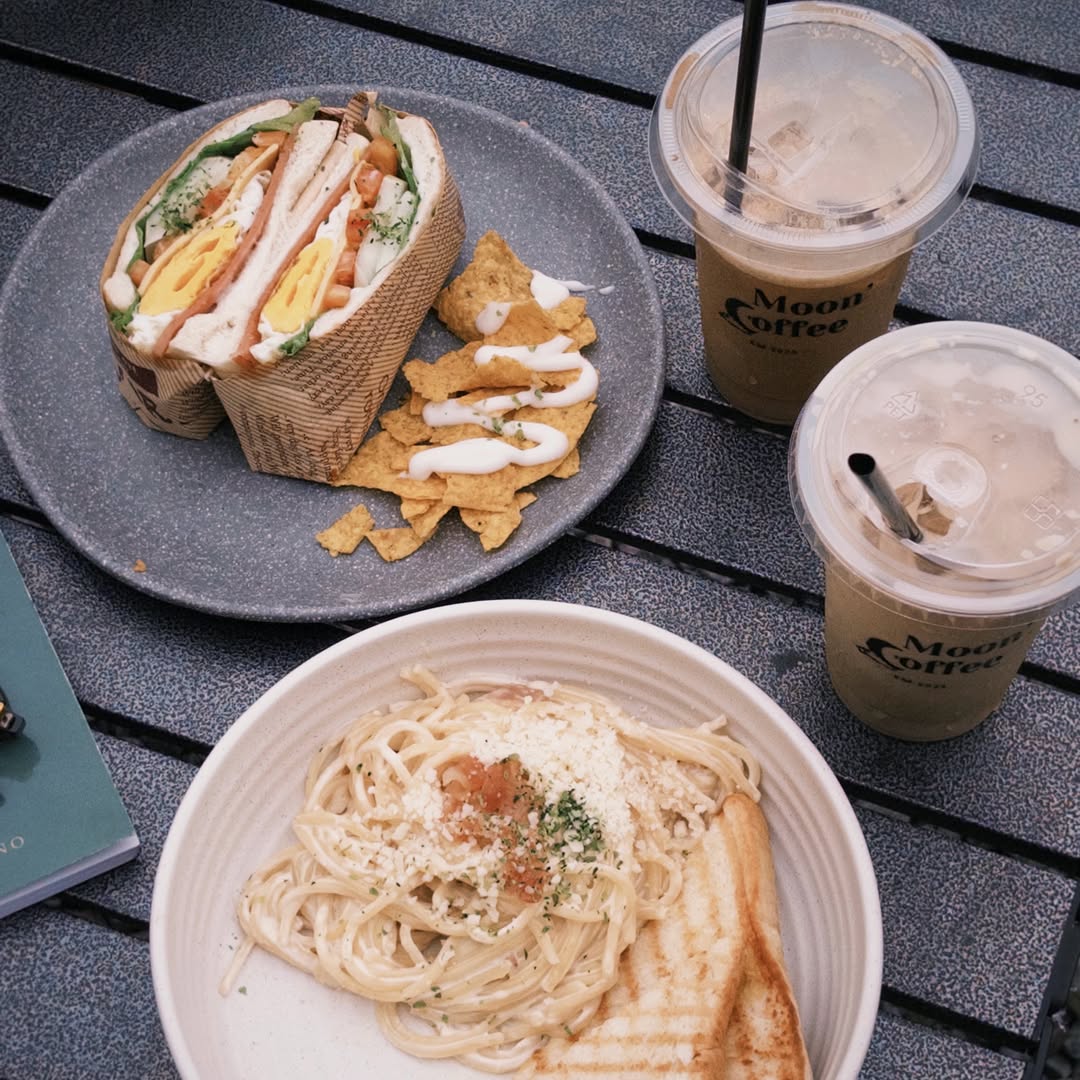 Club sandwich, aglio olio pasta, and iced coffees